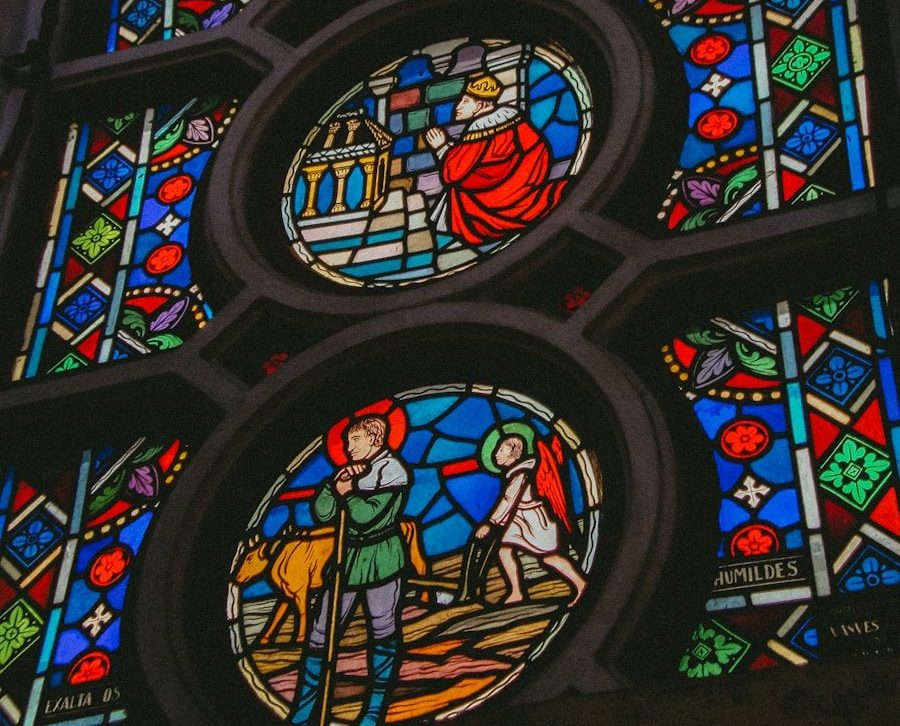 Circular stained glass windows with biblical scenes.